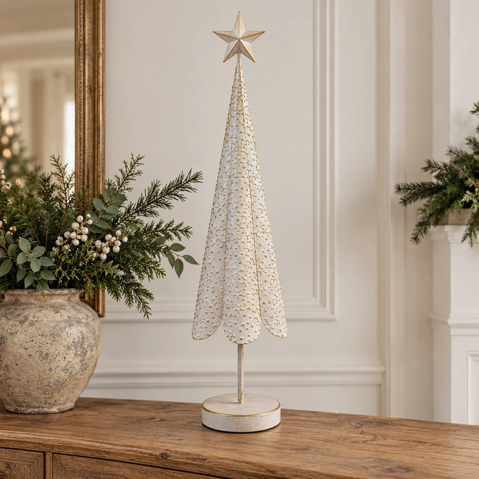 Extra large white metal Christmas tree with gold star details on an oak console.