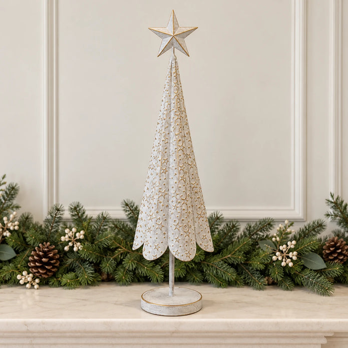 White and gold metal Christmas tree on a cream mantel with an evergreen garland