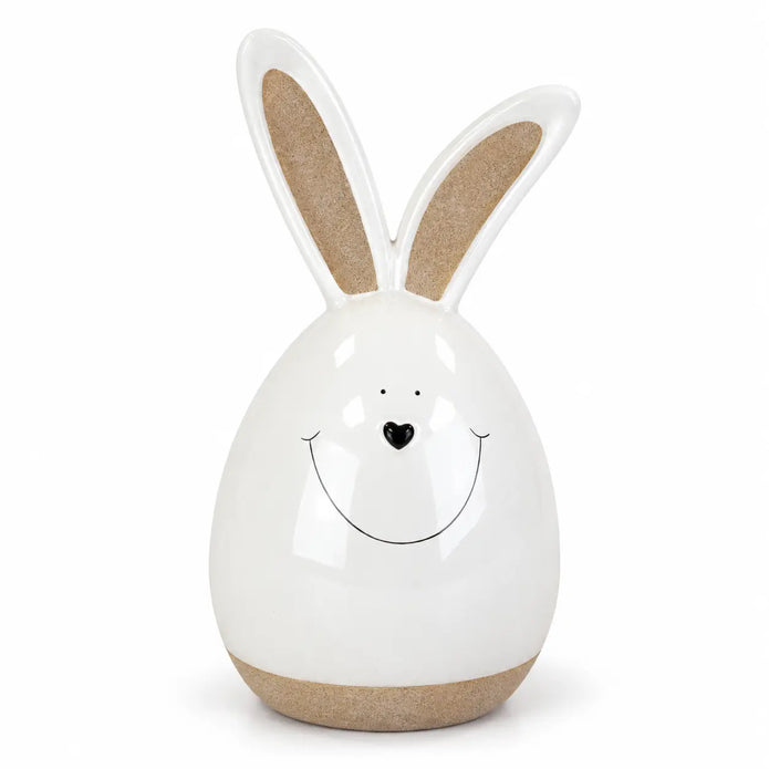 White ceramic rabbit with beige ears and base isolated on white.