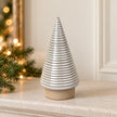 White ceramic ribbed Christmas tree ornament by Satchville, medium size, ideal for holiday decor on mantels or tabletops.