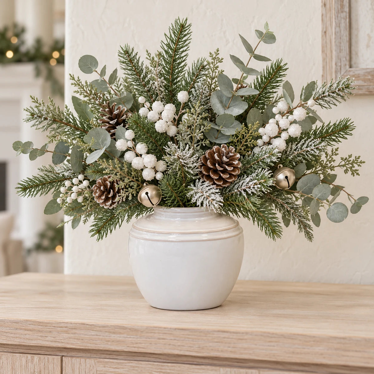 small white rustic ceramic vase, 17 × 17 × 16 cm, console with neutral foliage, white berries, champagne bells and pine cones