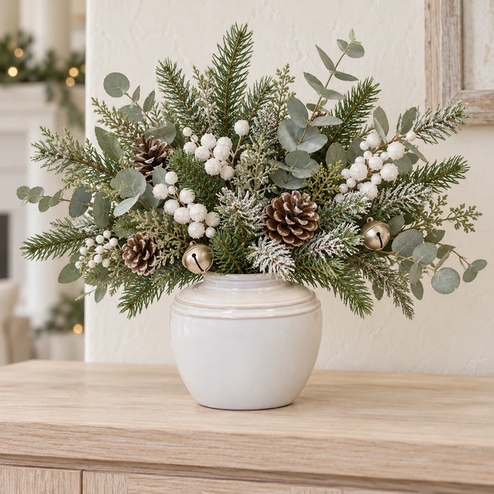 small white rustic ceramic vase, 17 × 17 × 16 cm, console with neutral foliage, white berries, champagne bells and pine cones