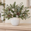 small white rustic ceramic vase, 17 × 17 × 16 cm, console with neutral foliage, white berries, champagne bells and pine cones