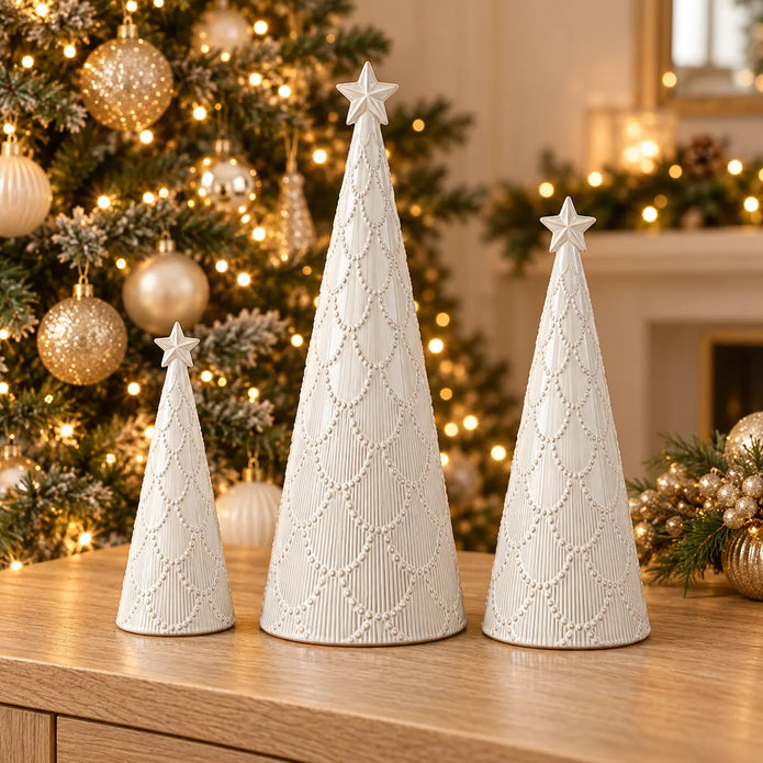 Small, medium and large white scalloped glazed ceramic Christmas trees with sparkling Christmas lights; sold separately