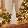 Small white scalloped glazed ceramic Christmas tree by Satchville, featuring a festive design perfect for holiday decor.