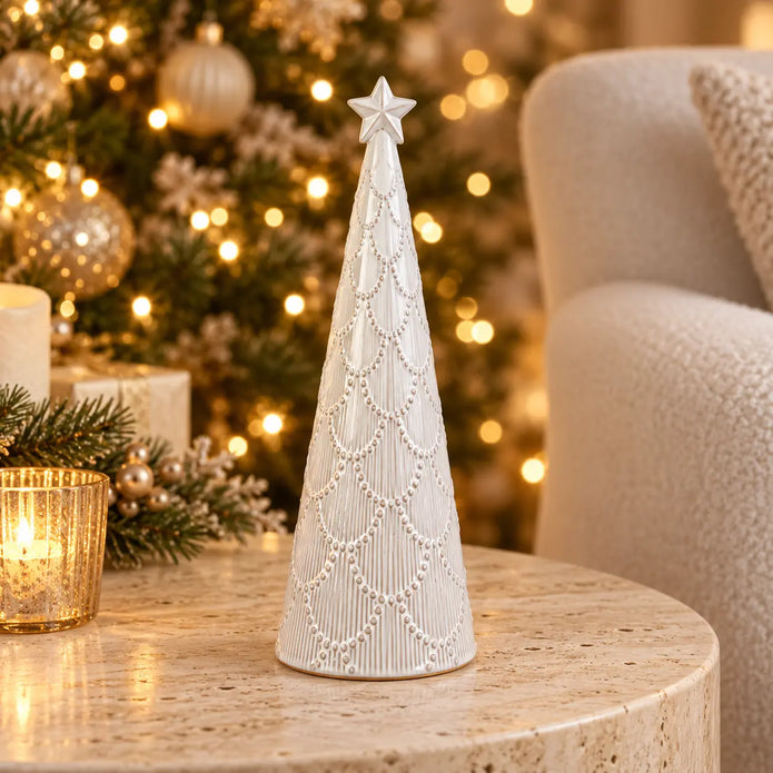 Small white scalloped glazed ceramic Christmas tree by Satchville, featuring a festive design with scalloped edges on a table display.