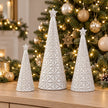 Small, medium and large white star glazed ceramic Christmas trees with sparkling lights; sizes sold separately