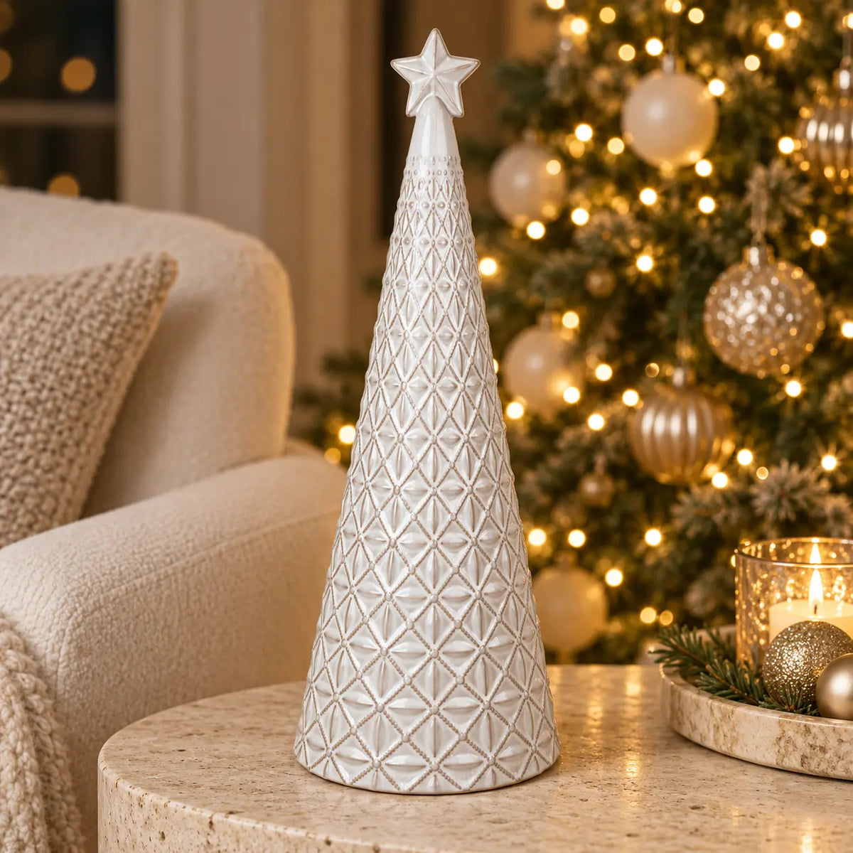 large white star glazed ceramic Christmas tree in a festive setting with warm sparkling Christmas lights
