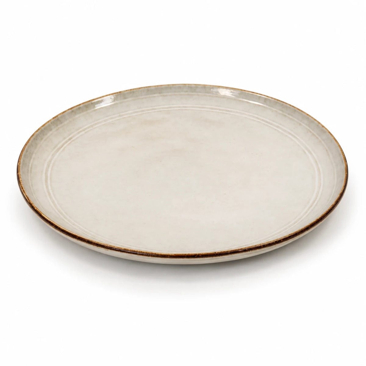 Empty white stoneware dinner plate isolated on a white background