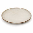 Empty white stoneware dinner plate isolated on a white background