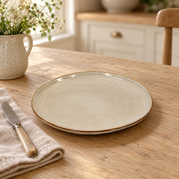 White Satchville stoneware side plate for kitchen and dining, featuring a simple, elegant design on a plain background.
