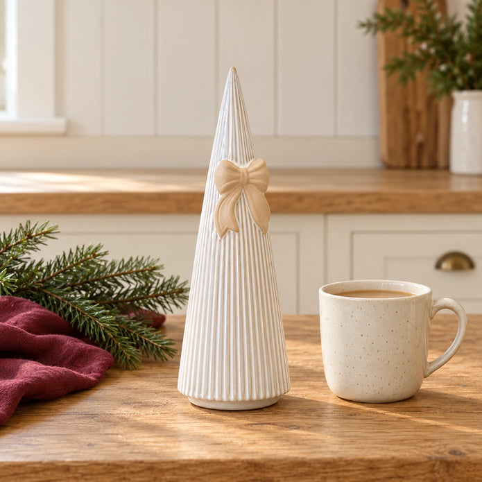 White Stoneglazed striped Christmas tree with bow by Satchville on a kitchen scale, medium size