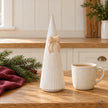 White Stoneglazed striped Christmas tree with bow by Satchville on a kitchen scale, medium size