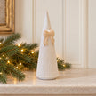 Satchville medium white stoneglazed striped Christmas tree with bow on mantel