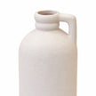 Close-up of the white bottle vase's textured finish, ringed neck and small rectangular handle