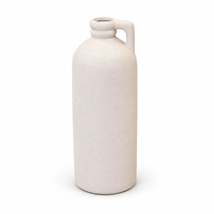Full white tall textured bottle vase with small handle on a white studio background