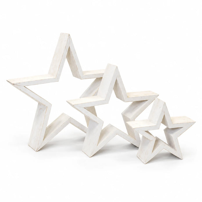 Set of three whitewashed wooden outline stars on a white studio background