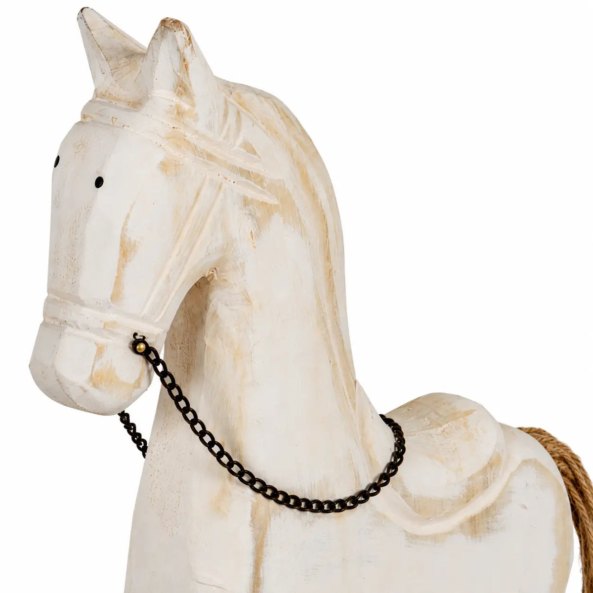 Close-up of distressed whitewashed wood, carved mane and chain rein