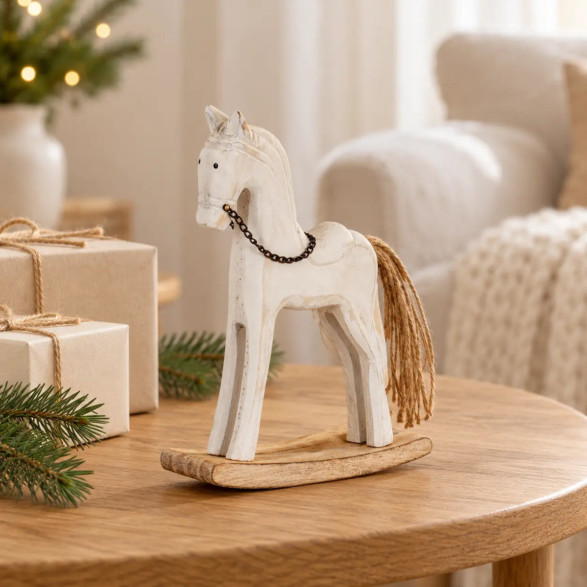 Small 20 cm whitewashed rocking horse beside neutral presents