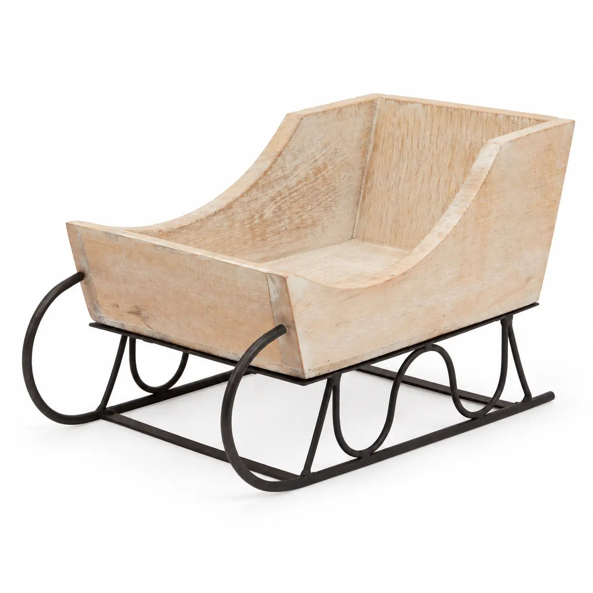 Whitewashed wooden decorative sleigh with dark metal runners on white