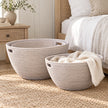 Wickham rattan laundry baskets by Lows displayed in a bedroom alcove