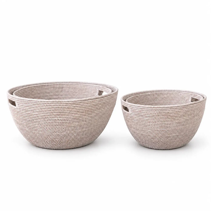 Lows Wickham rattan laundry baskets in a natural woven design, shown in a studio setting
