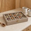 Wickham Rattan Nespresso Coffee Pod Or Wax Melt Storage Box, closed glass-topped woven box holding coffee pods on a kitchen counter