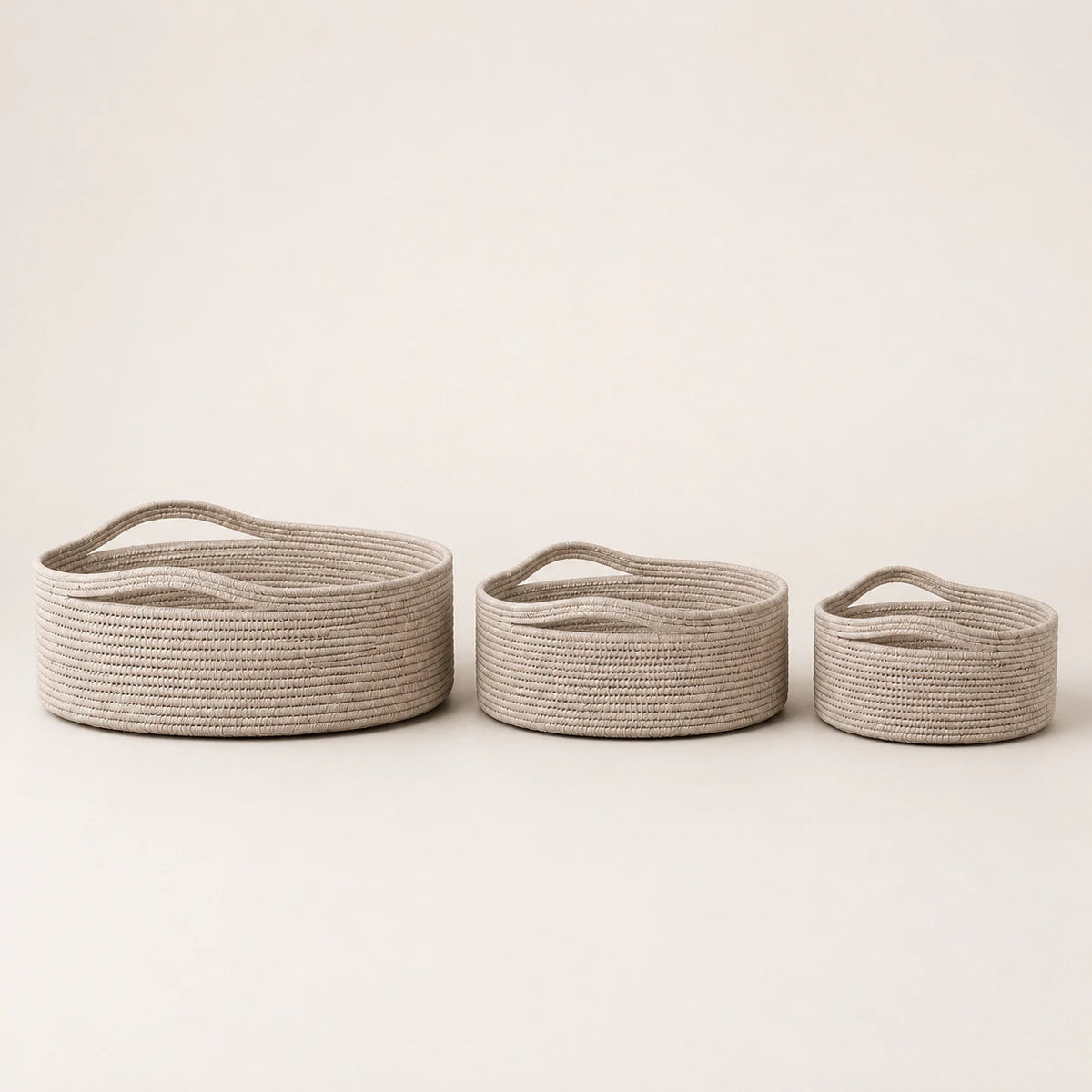 Wickham Rattan Oval Storage Basket, three pale woven baskets in graduated sizes against a light background