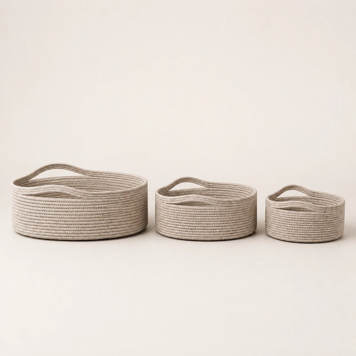 Wickham Rattan Oval Storage Basket, three pale woven baskets in graduated sizes against a light background