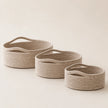 Wickham Rattan Oval Storage Basket, three empty pale woven oval baskets with curved handles