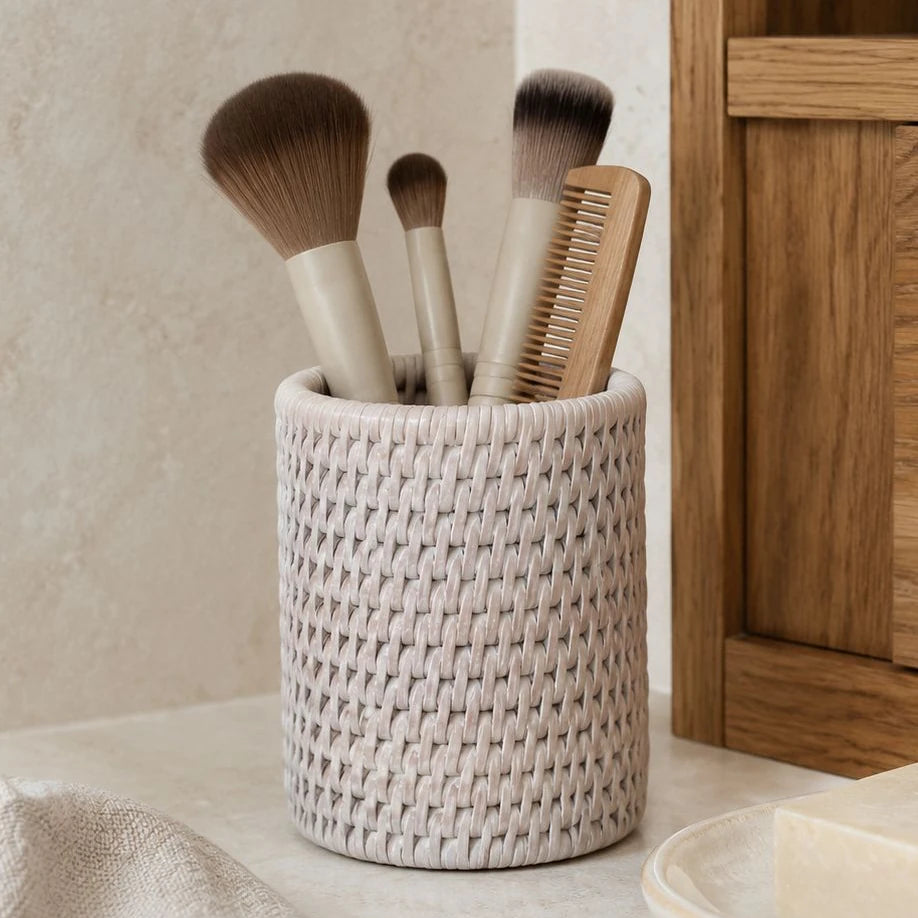 Wickham Rattan Pen Or Storage Pot, pale woven pot holding brushes and a comb beside a mirror