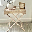 Lows rattan rectangle tripod side table with wooden legs, modern furniture piece for living room or bedroom decor.
