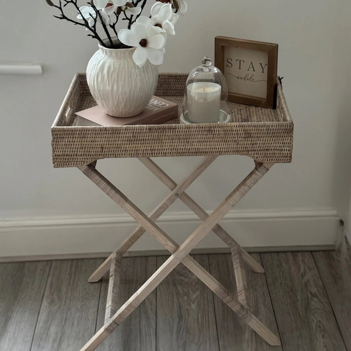 Lows rattan rectangle tripod side table with wooden legs, modern furniture piece for living room or patio decor.