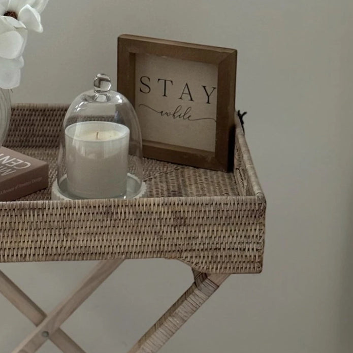 Lows rattan rectangle tripod side table with wooden legs and woven rattan surface, ideal for living room or bedroom decor.