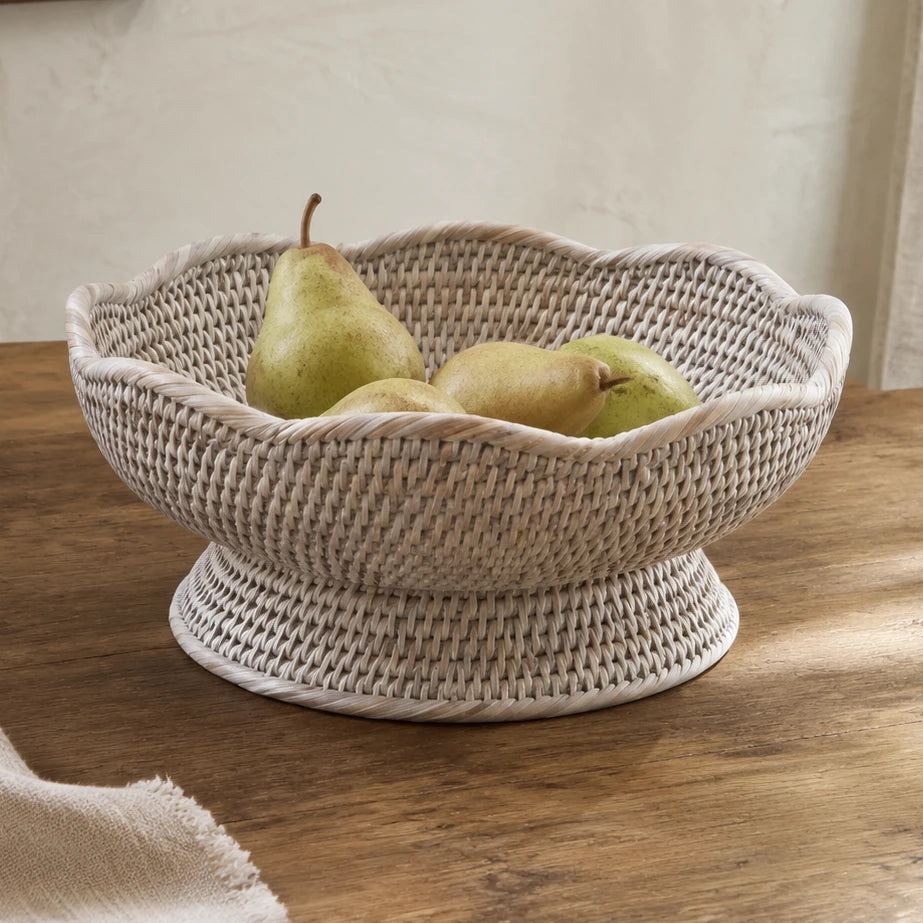 Wickham Rattan Scalloped Footed Fruit Bowl, scalloped woven footed bowl holding pears on a wooden table