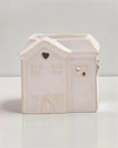Small beige ceramic house wax burner by Widdop & Co, decorative home fragrance accessory with a cozy house design.