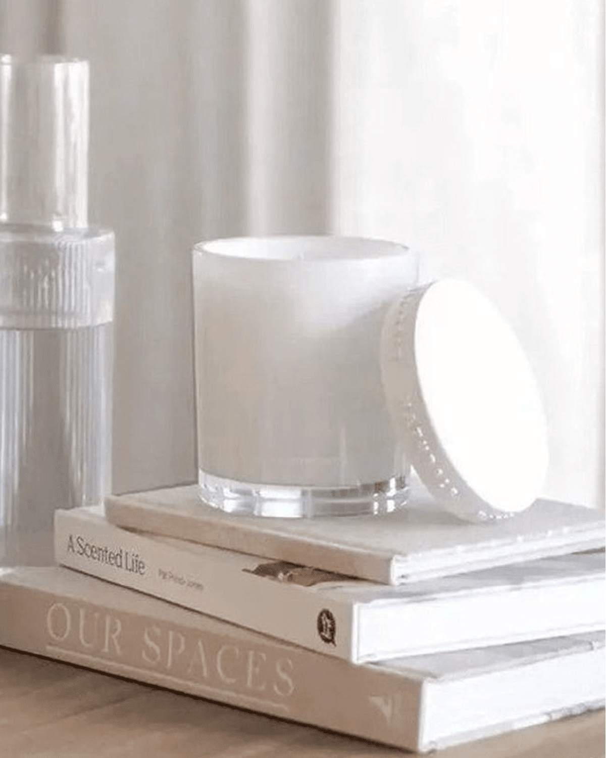 Naturals luxury glass lidded candle by Widdop & Co featuring rose, jasmine, and oud scent with a clear glass container and elegant lid.