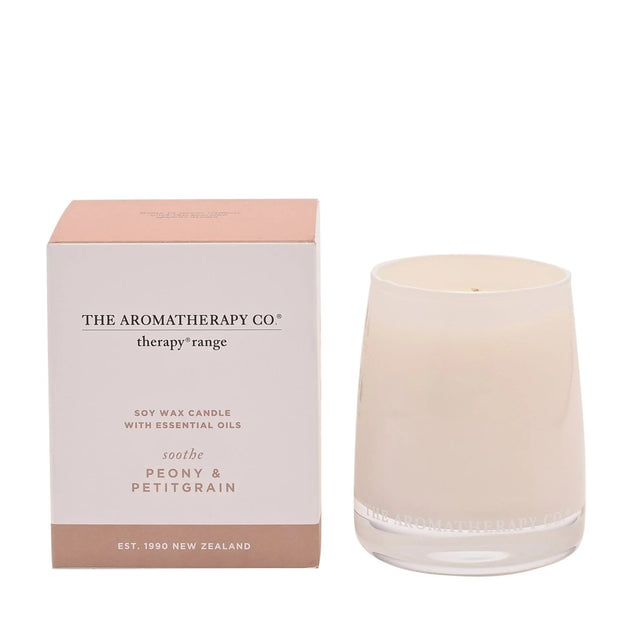 Soothe Therapy Candle by Widdop & Co with peony and petitgrain scent, featuring a white wax candle in a glass jar.