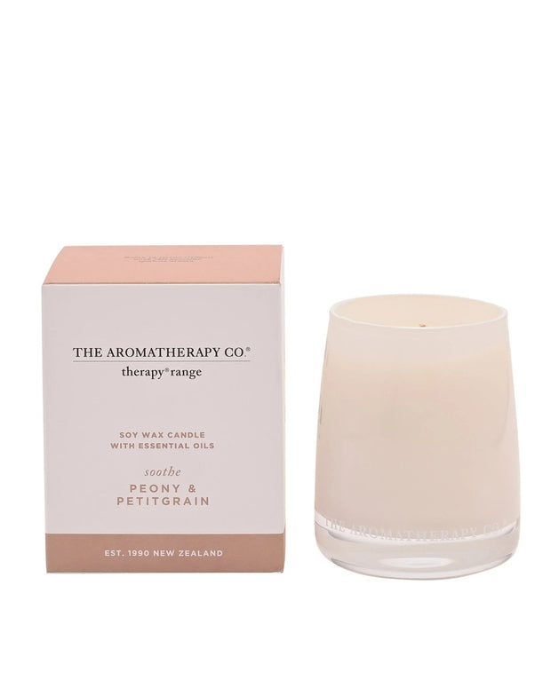 Soothe Therapy Candle by Widdop & Co with peony and petitgrain scent, featuring a white wax candle in a glass jar.