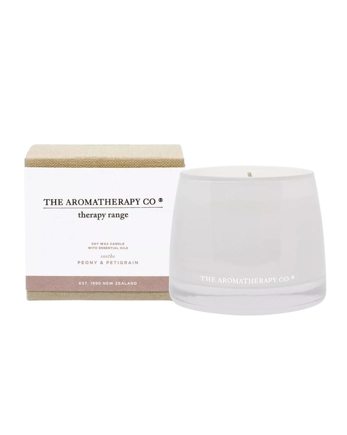 Widdop & Co Aromatherapy Candle Company Soothe candle with petigrain and peony scent, in a glass container.