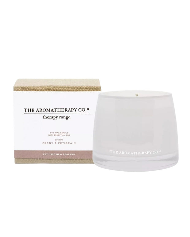 Widdop & Co Aromatherapy Candle Company Soothe candle with petigrain and peony scent, in a glass container.