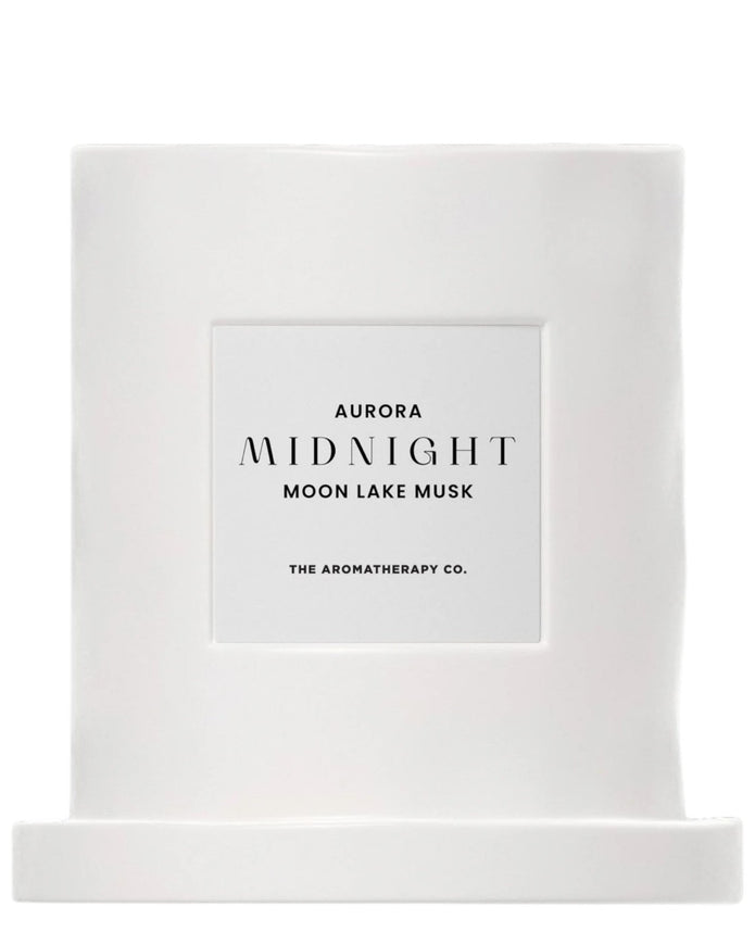 Widdop & Co Midnight Candle by The Aromatherapy Co. featuring Moon Lake Musk scent, with a sleek candle design and soft glow.