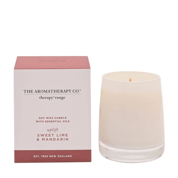 Widdop & Co Uplift Therapy Candle with sweet lime and mandarin scent, featuring a white wax candle in a glass jar.