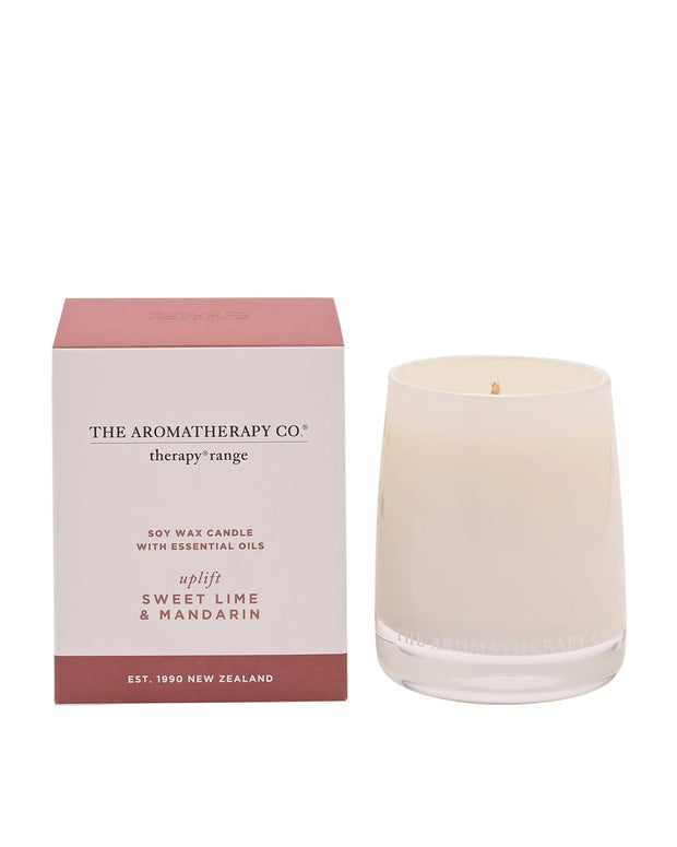 Widdop & Co Uplift Therapy Candle with sweet lime and mandarin scent, featuring a white wax candle in a glass jar.