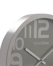 Metallic silver round wall clock by Widdop & Co with black hour and minute hands on a sleek face.