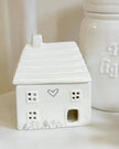 Beige ceramic house oil burner by Widdop & Co, decorative gift item with detailed house design for aromatherapy use.