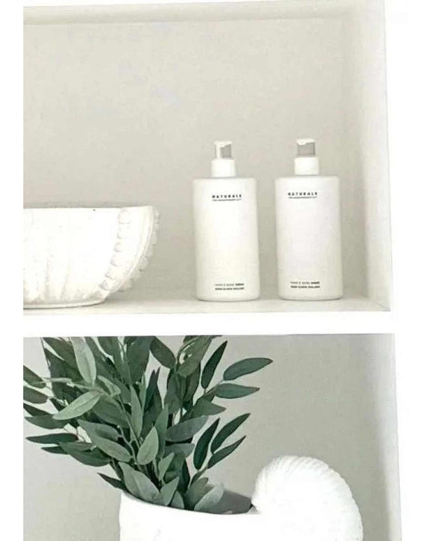 Naturals Luxury Hand and Body Lotion by Widdop & Co with rose, jasmine, and oud scent, in a stylish gift bottle.