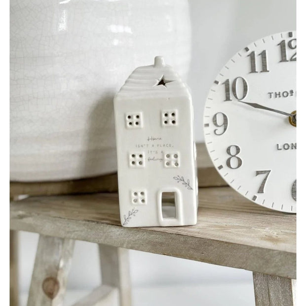 Beige ceramic house tea light holder by Widdop & Co, ideal for home décor and ambient lighting.