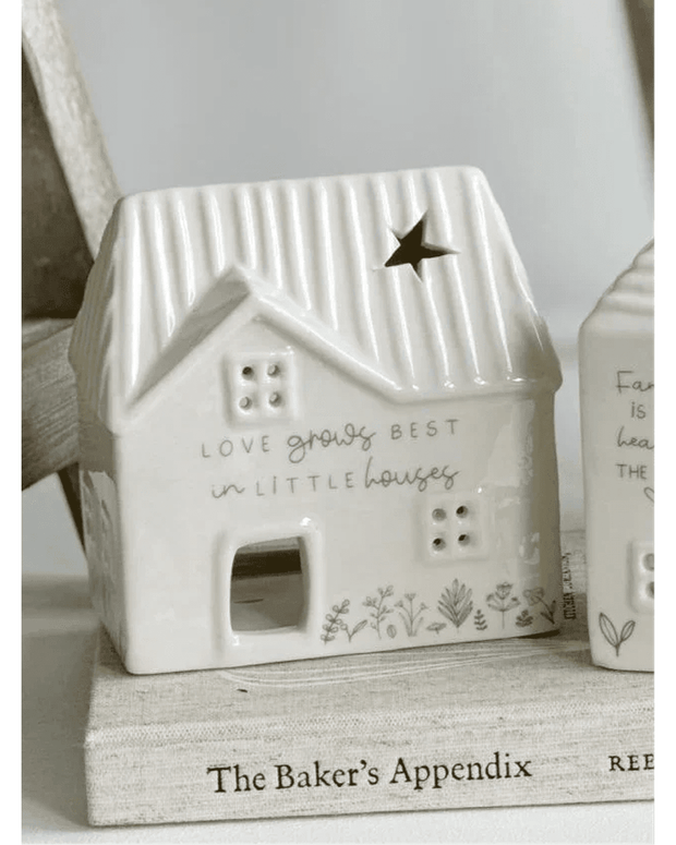 Beige ceramic house tea light holder from Widdop & Co's Moments Little Houses home décor collection, with a cozy, detailed design.