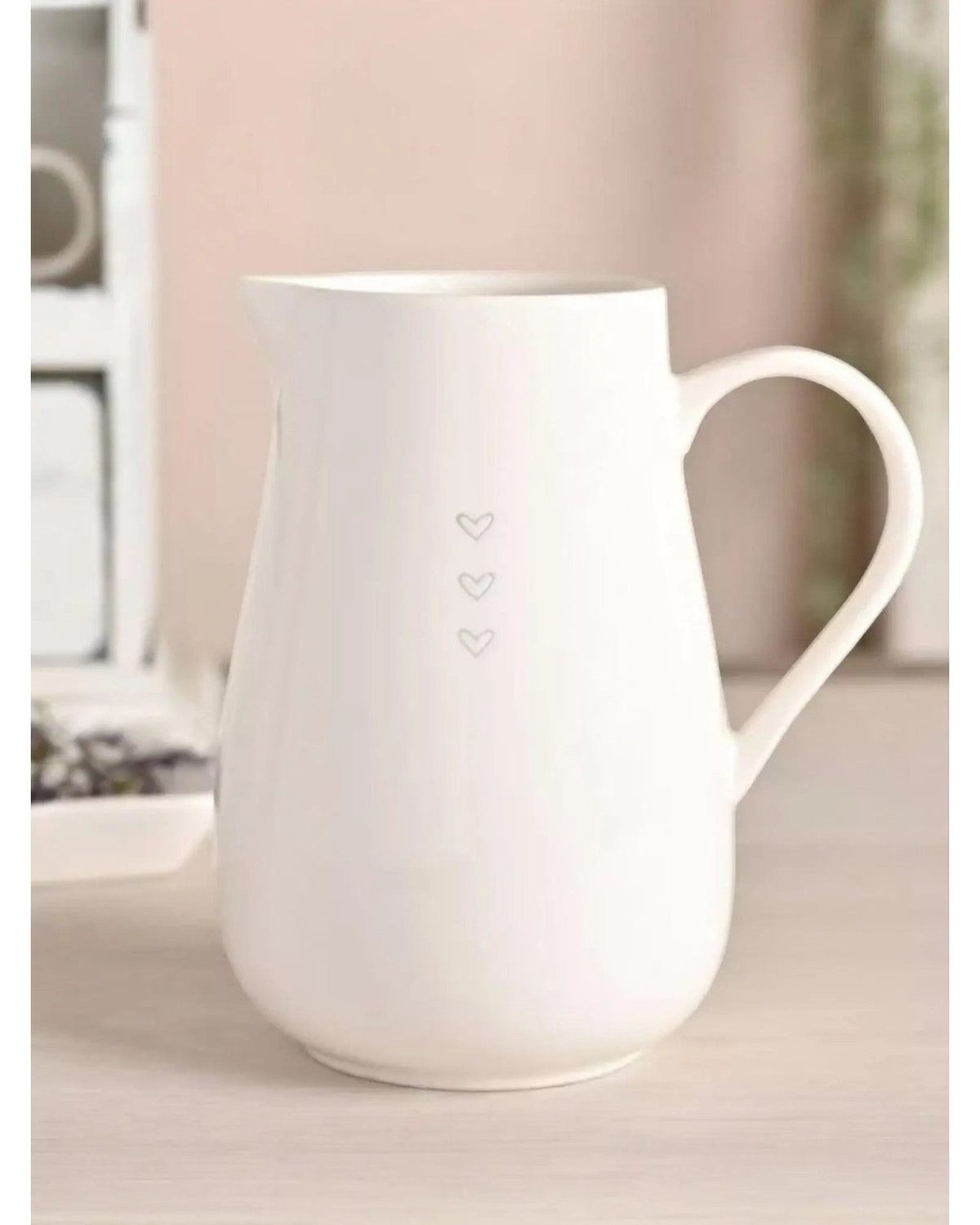 Beige Widdop & Co Moments White Jug with three heart designs, ideal for kitchen and dining decor.